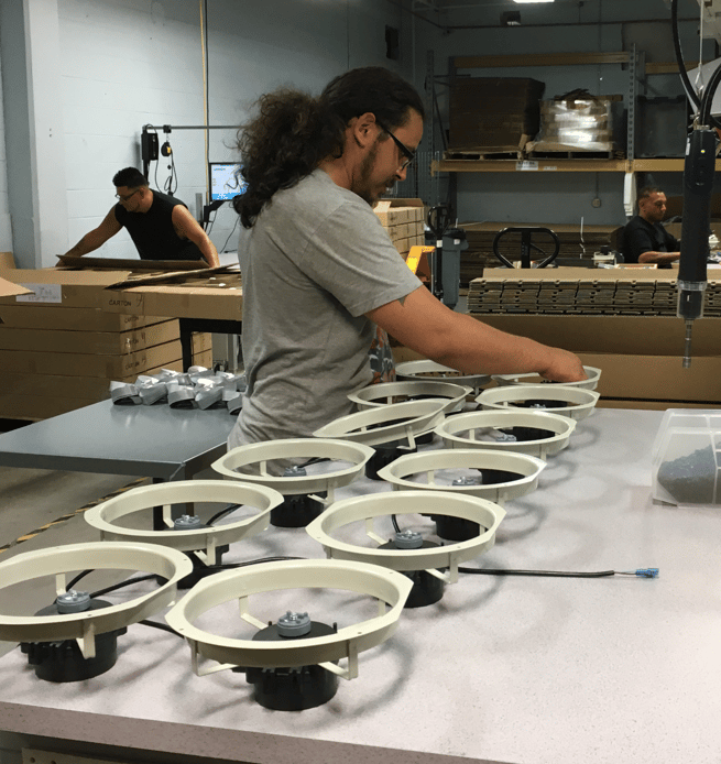 Employee Assembling EC Motor with Fan Ring and Blade