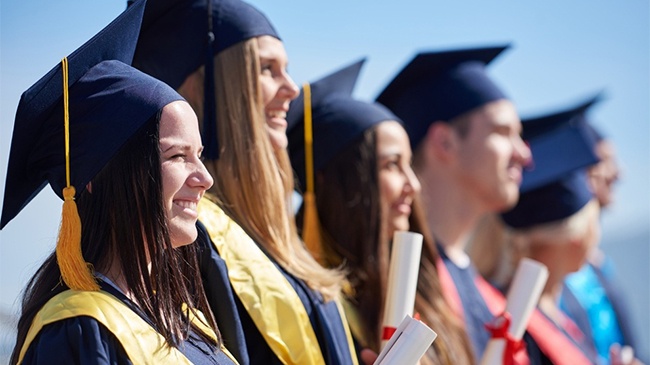 Young Graduates Celebrating on Graduation Day