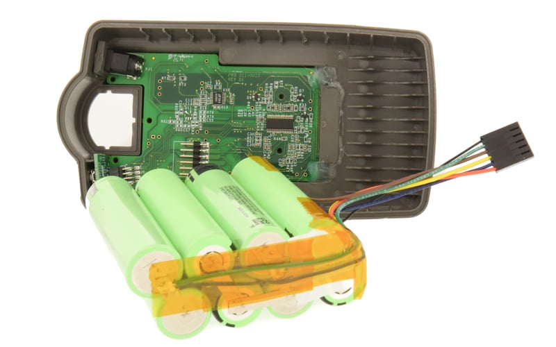 Example of battery pack enclosure, BMS, cells and harness during assembly process.