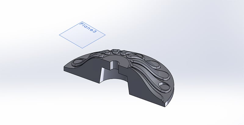 Additional construction plane in made to extrude cut a flat for mounting holes