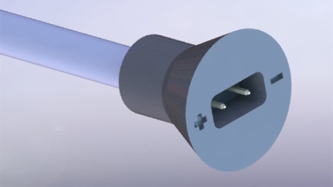 3D model of a custom cable connector with polarity markings.