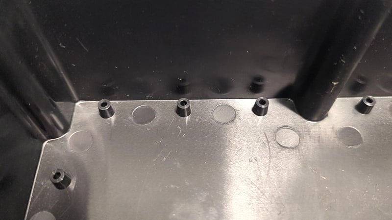 Ejector pin marks left over from the molding process