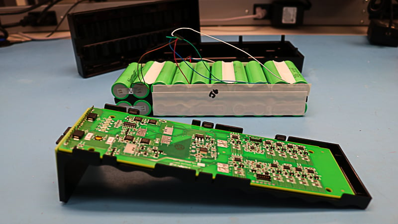 Inside of custom battery pack showing electronics, components, and materials