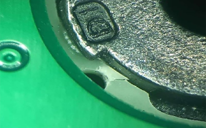 Fracturing of PCB laminate material due to tight location of non-plated drill hole 