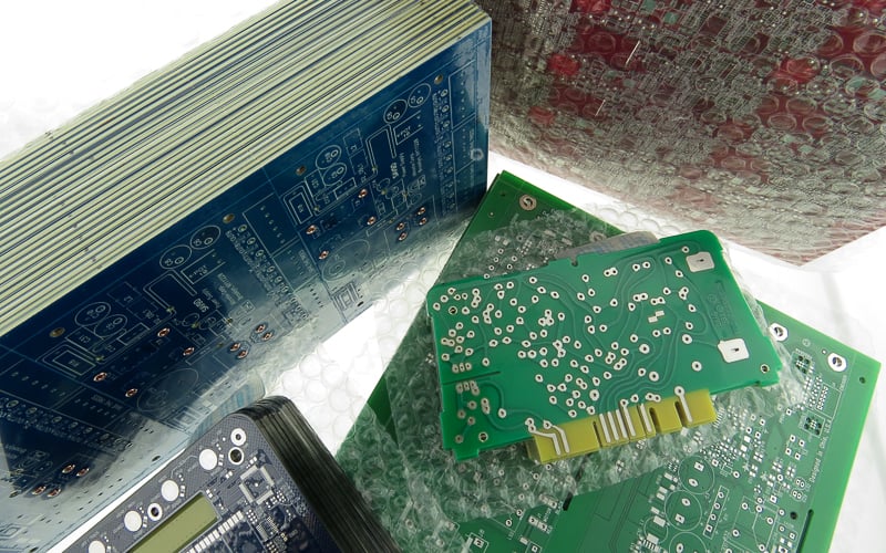 Various printed circuit boards packaged in bubble wrap.