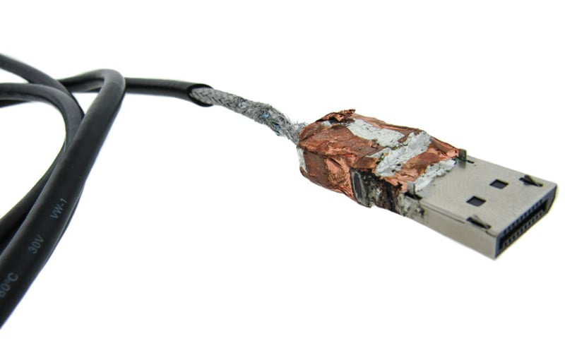 Shielded USB cable with foil shield layer that covers the USB connector body