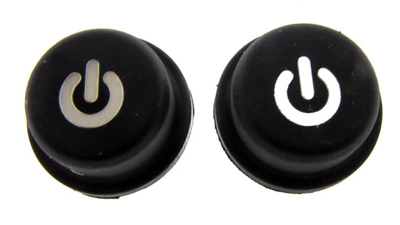 Silicone molded buttons with laser etched icon- right button is backlit