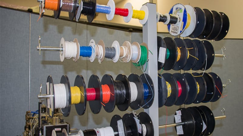 Spools of cable and wire used in cable assembly manufacturing