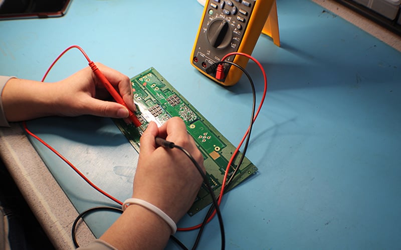 Testing a circuit board with a multimeter