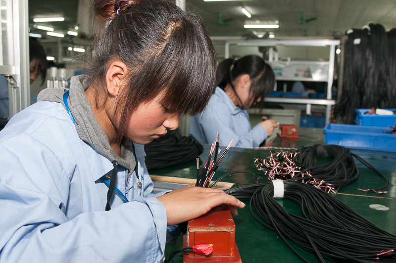 Cable assemblies being manufactured in China.