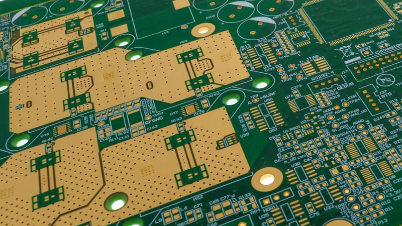 Printed circuit board with thermal vias to draw heat away from component